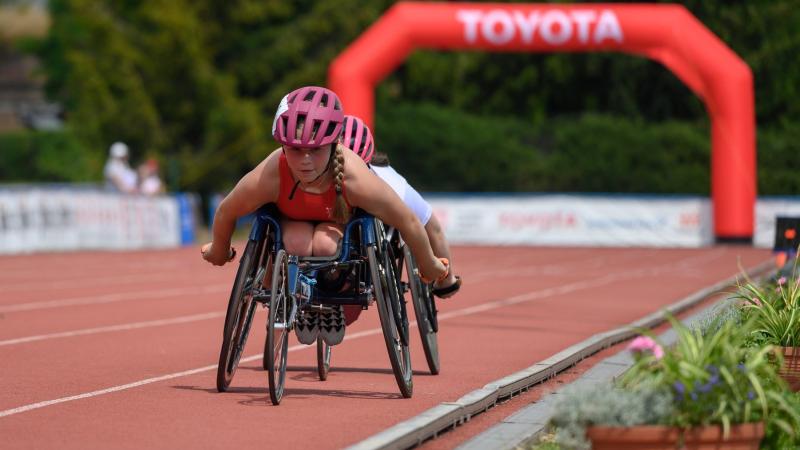 A wheelchair racing athlete in action