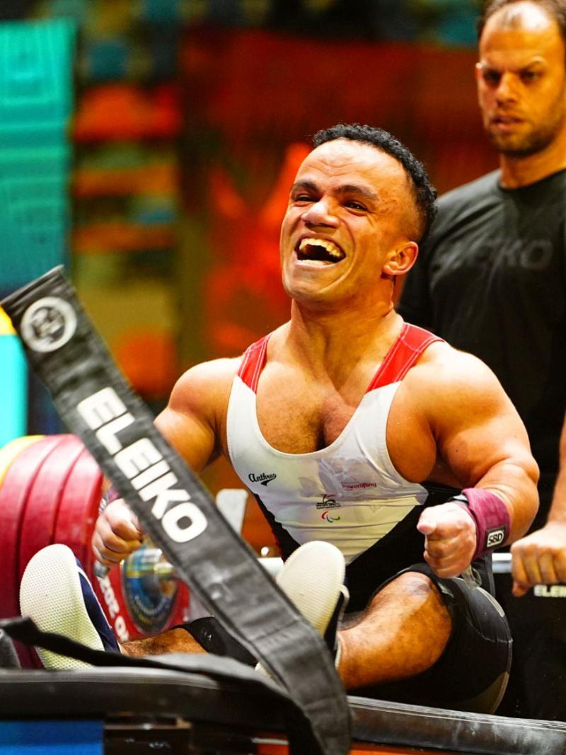 An athlete celebrates in joy