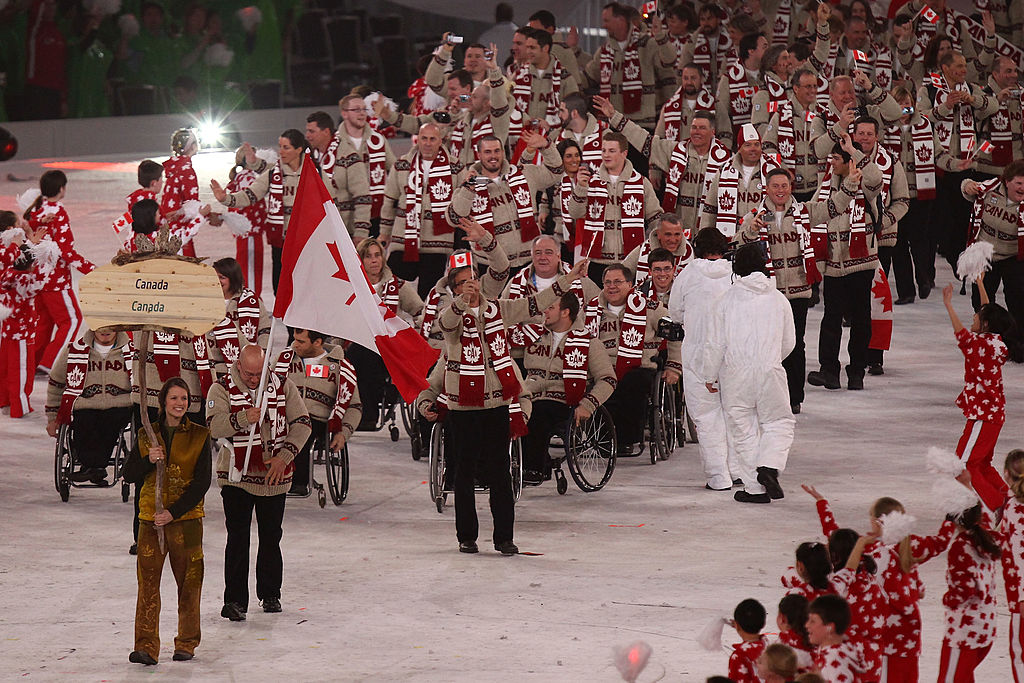 Flag bearer Jean Labonte of Canada leads his team through the stadium during the Opening Ceremony of the 2010 Vancouver Paralympic Winter Games. 