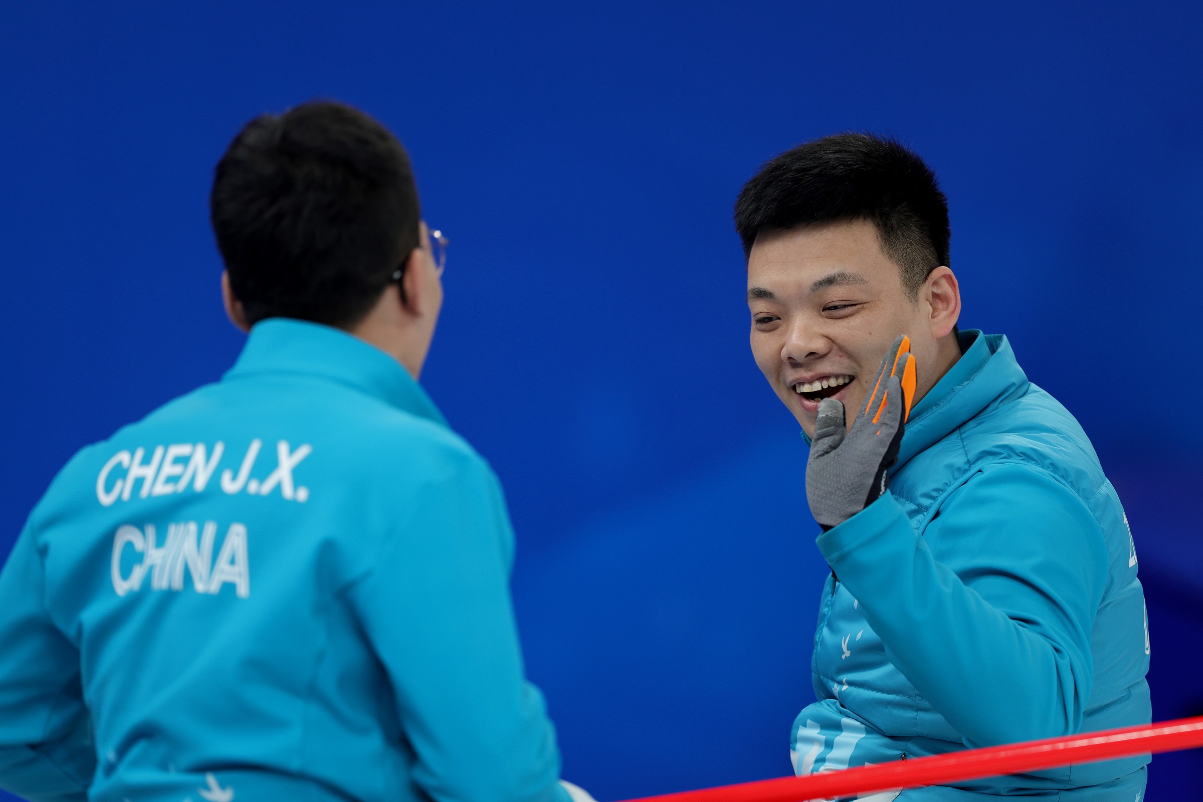 Chinese Wheelchair Curling team members celebrate during one of their Beijing 2022 matches