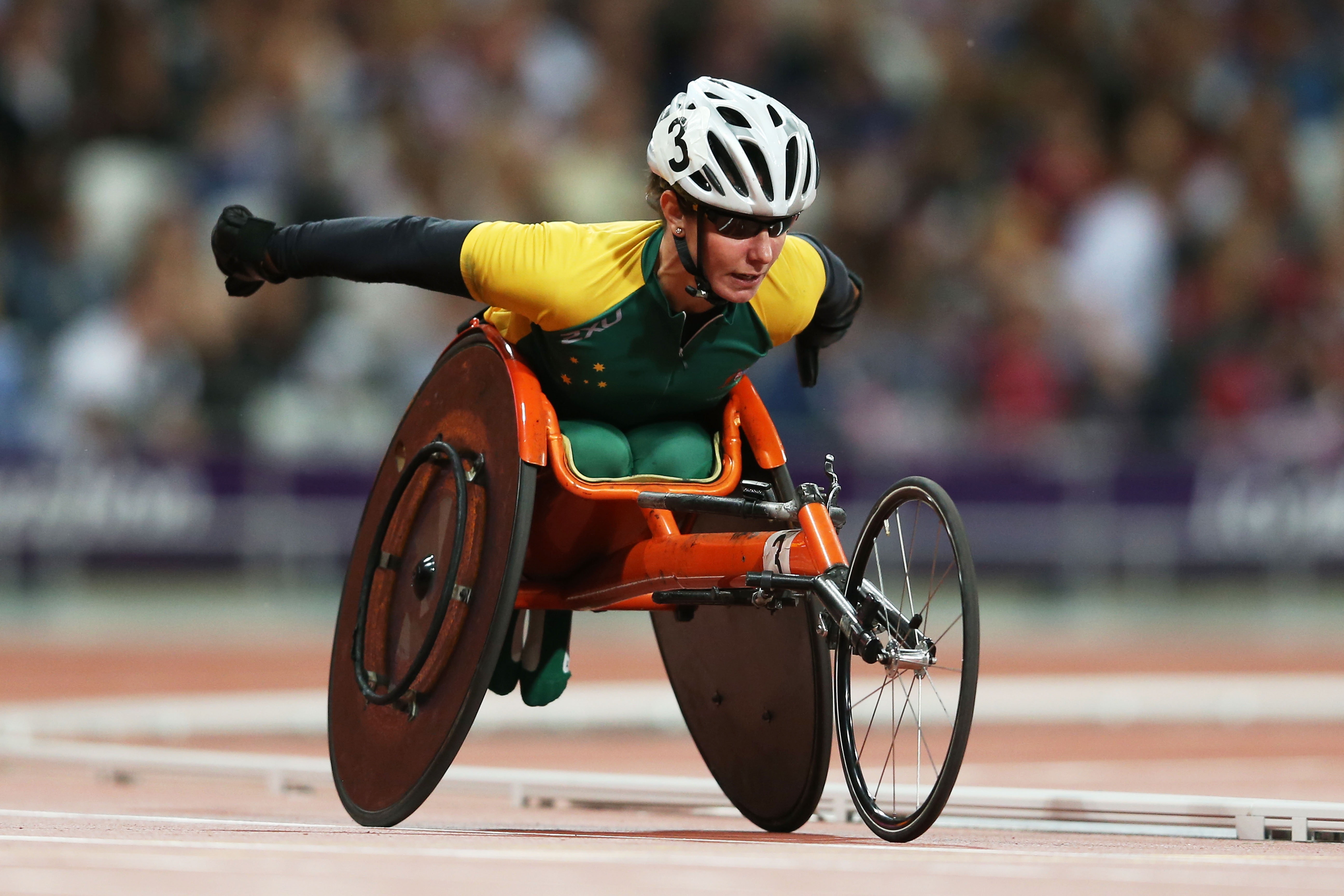 A picture of a woman in a wheelchair during a wheelchair race