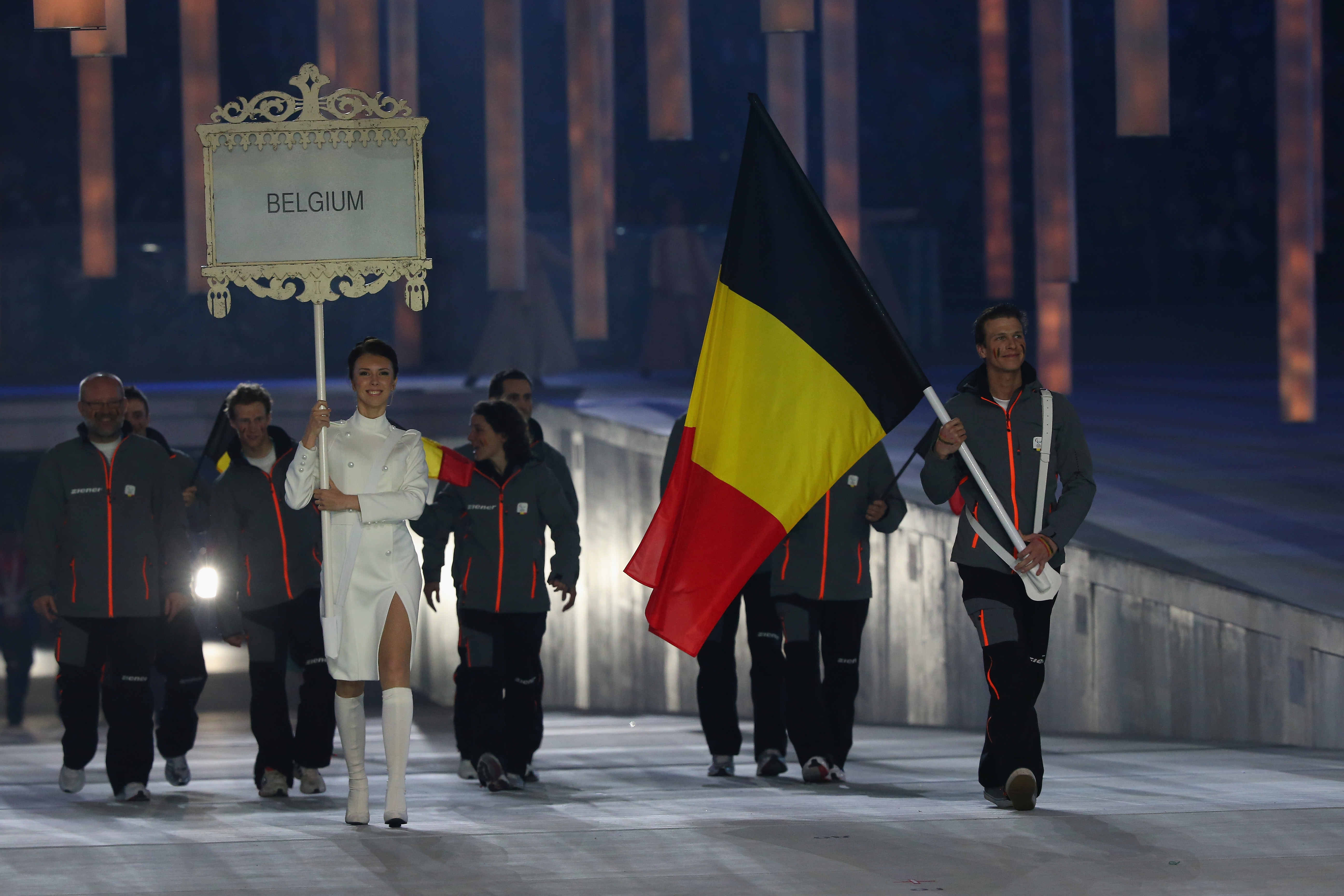 Belgium enter the arena lead by flag bearer Denis Colle during the Opening Ceremony of the Sochi 2014 Paralympic Winter Games
