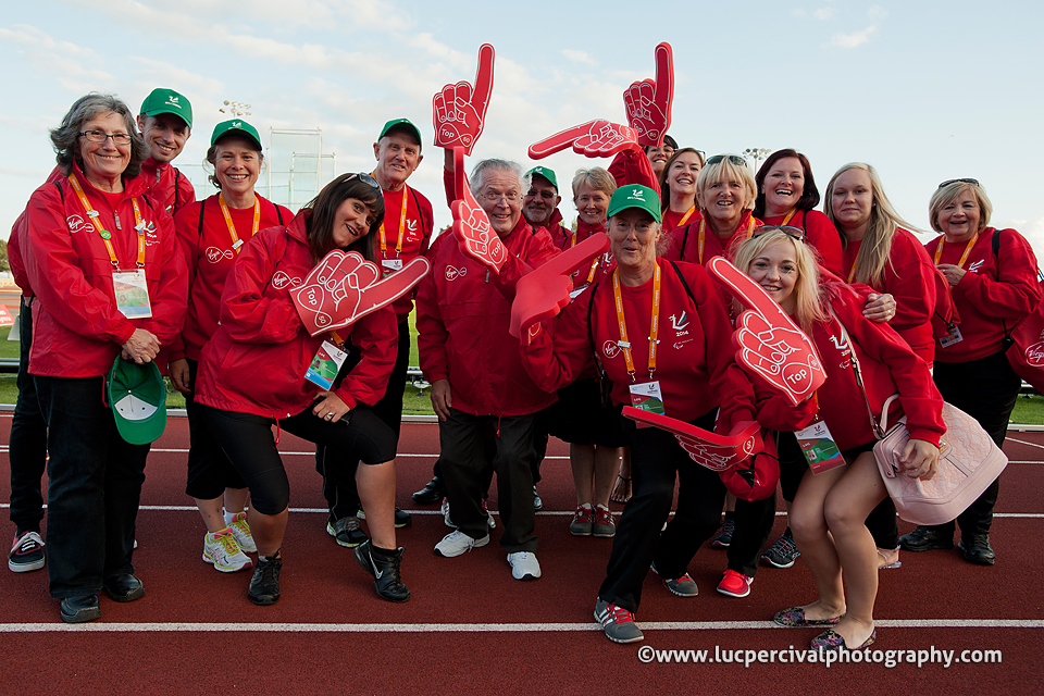 Some volunteers at the Swansea 2014 IPC Athletics World Championships pose for a photo.