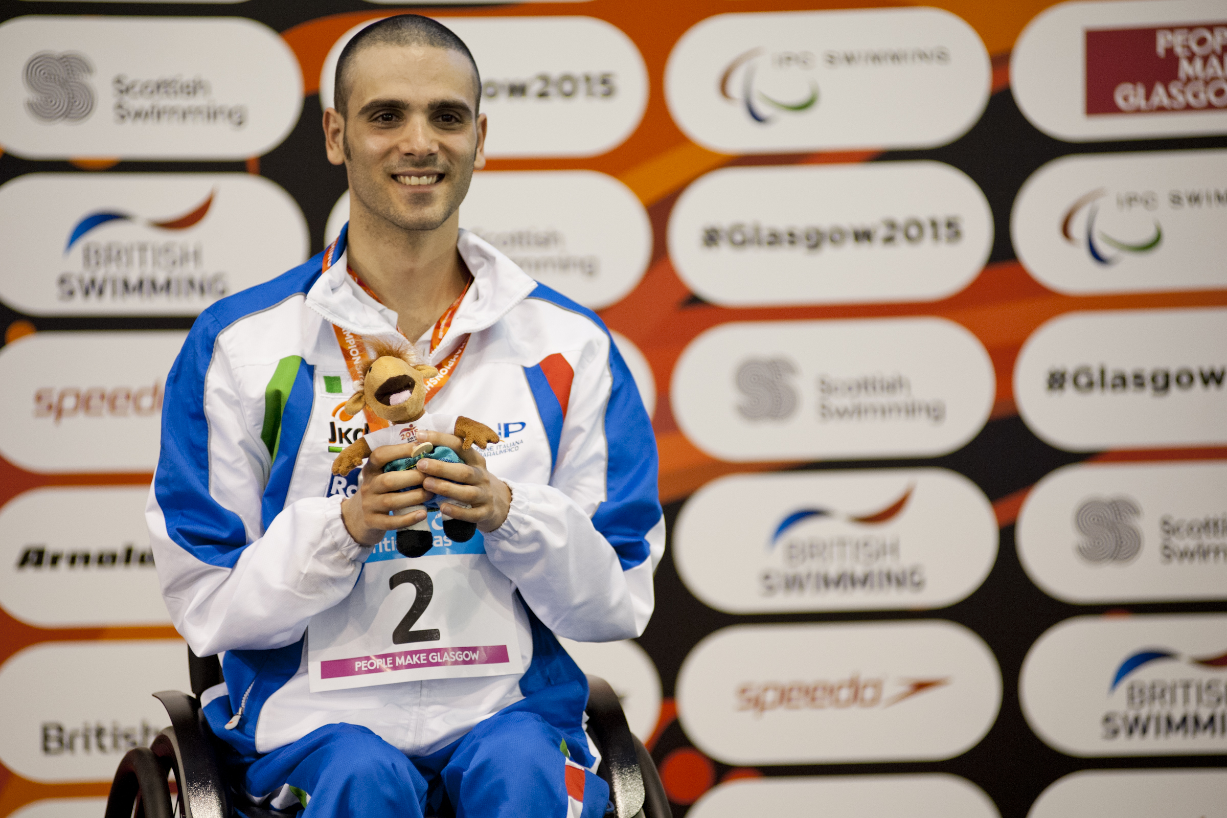 Vincenzo Boni of Italy on the podium after the Men's 50m Backstroke S3 at the 2015 IPC Swimming World Championships in Glasgow.