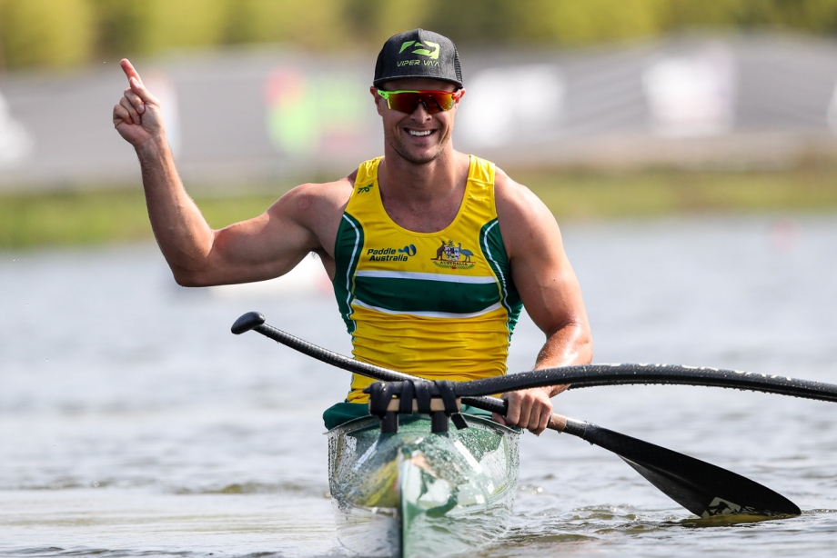 Man in a canoe celebrating