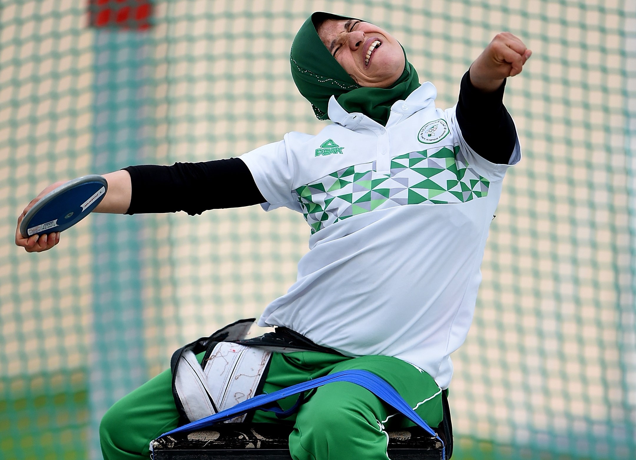 Female Para athlete Mounia Gasmi throws a discus