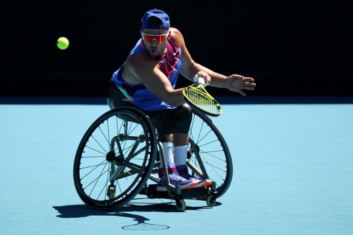 Dylan Alcott of Australia plays a forehand in his men's Quad Wheelchair singles semifinals against Andy Lapthorne of Great Britain at the 2022 Australian Open.