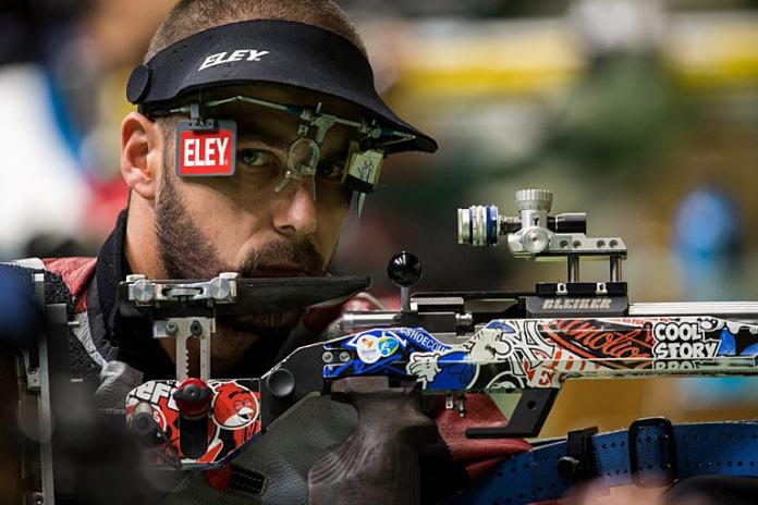A close-up shot of a male shooting Para sport athlete in competition