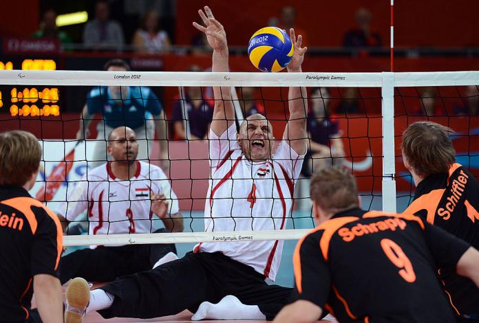Male sitting volleyball athletes in action at London 2012