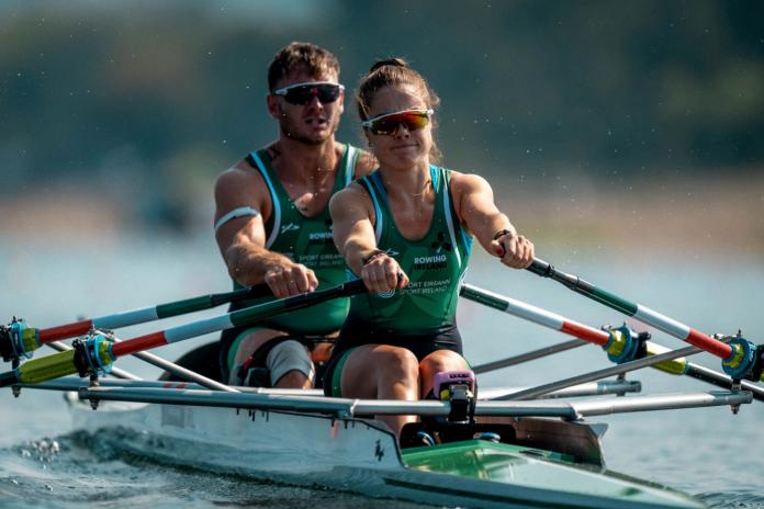 A female and male Para rowers competing