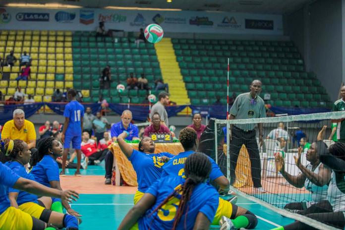 Female sitting volleyball athletes in competition