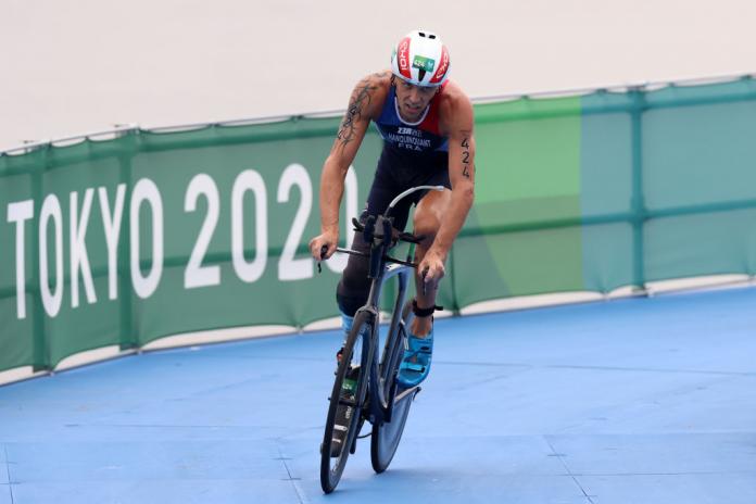 A male triathlete competes in the cycling segment