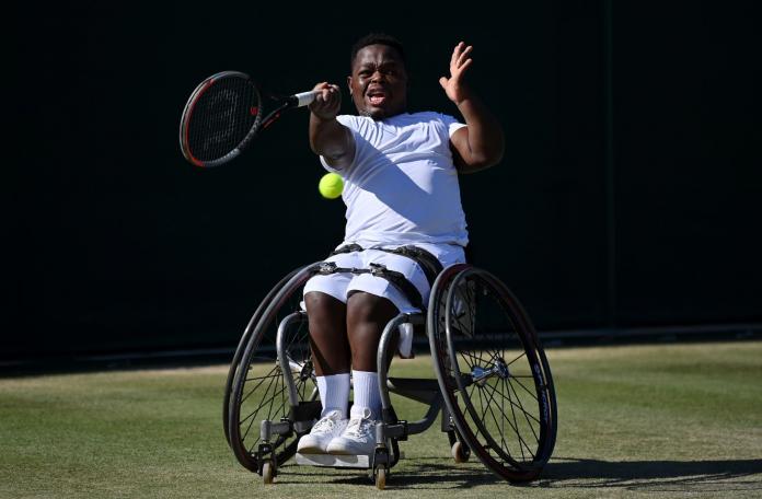 A male wheelchair tennis player in action