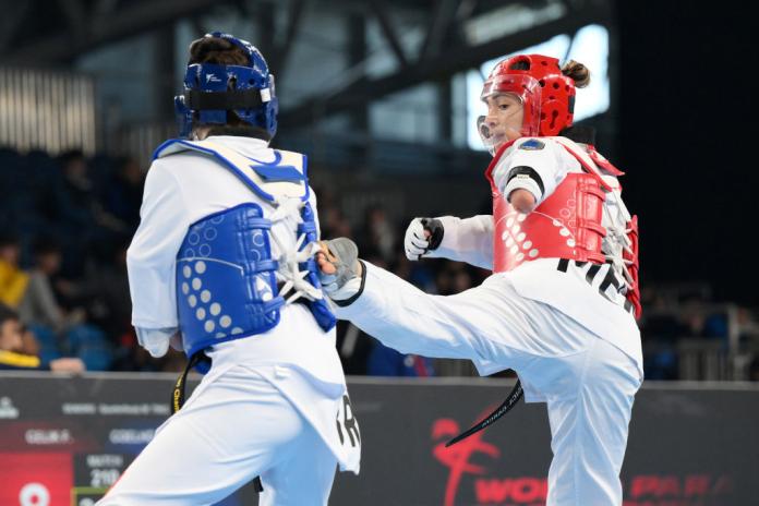 Two female Para taekwondo athletes in action