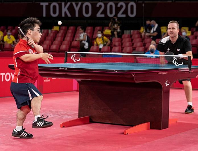 Two male Para athletes in action during a Para table tennis match at Tokyo 2020