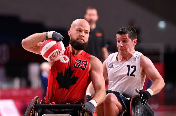 A male wheelchair rugby player in action during the Tokyo 2020 Paralympics.
