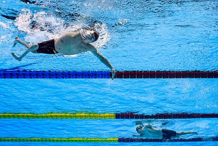 A male Para swimmer competes