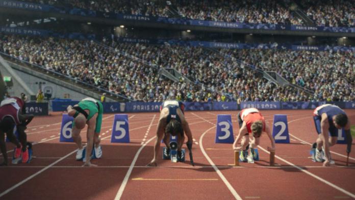 An image of five sprinters preparing for their race at the starting blocks