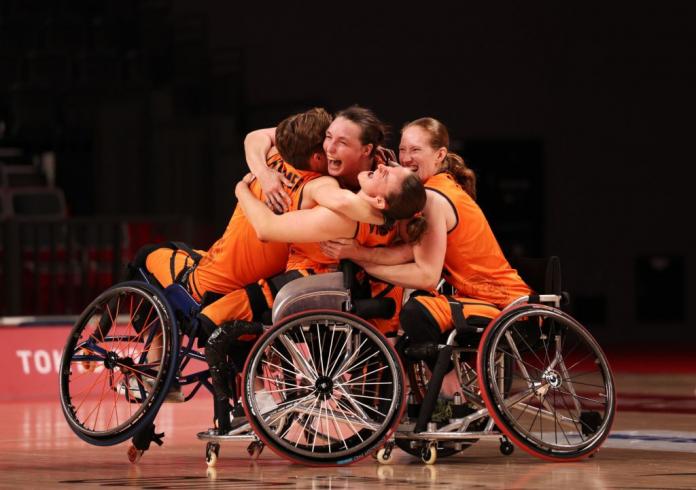 Members of the Dutch wheelchair basketball team celebrate
