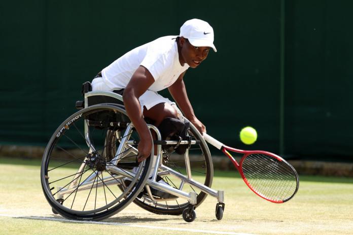 Wheelchair tennis player Kgothatso Montjane in action on a grass court