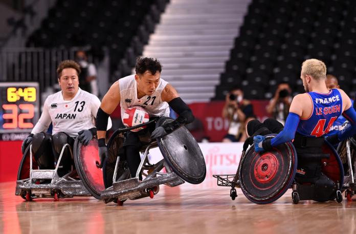 A close-up image of a male wheelchair rugby players