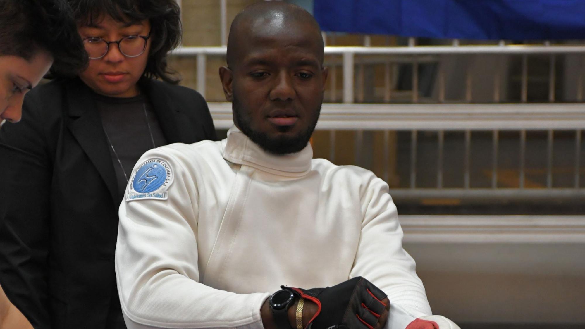 Amelio Castro Gruesso, a member of the Refugee Paralympic Team at Paris 2024, is wearing his wheelchair fencing gear