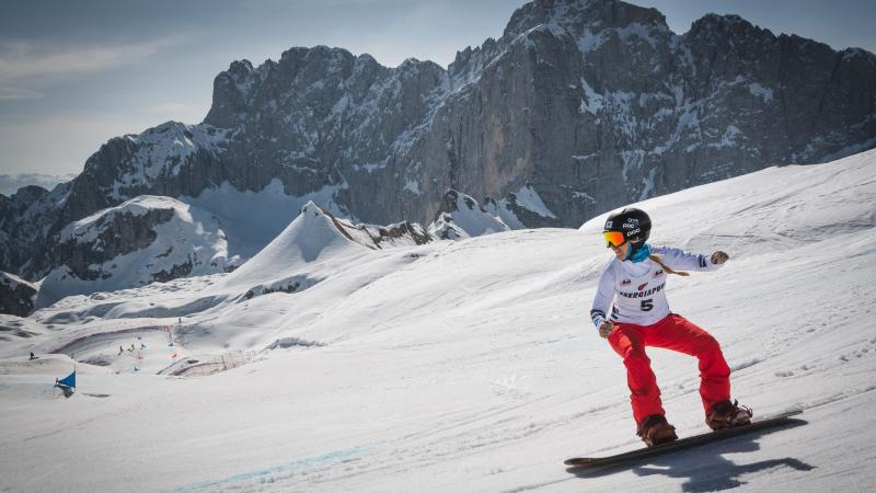 A female snowboarder in the snow