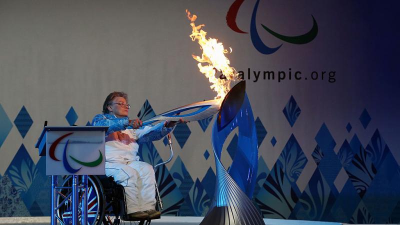 File photo of Paralympian Caz Walton lighting the torch during the Paralympic Heritage Flame lighting ceremony at Stoke Mandeville Stadium in England.