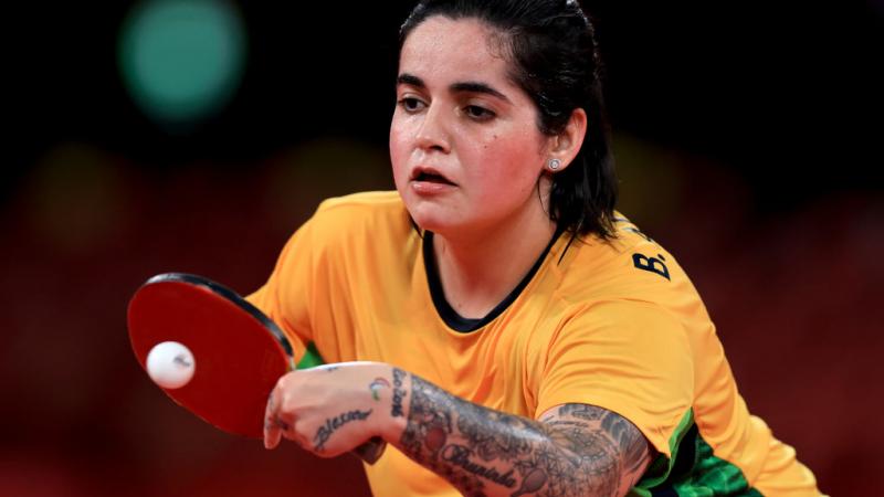 A female Para table tennis player in action