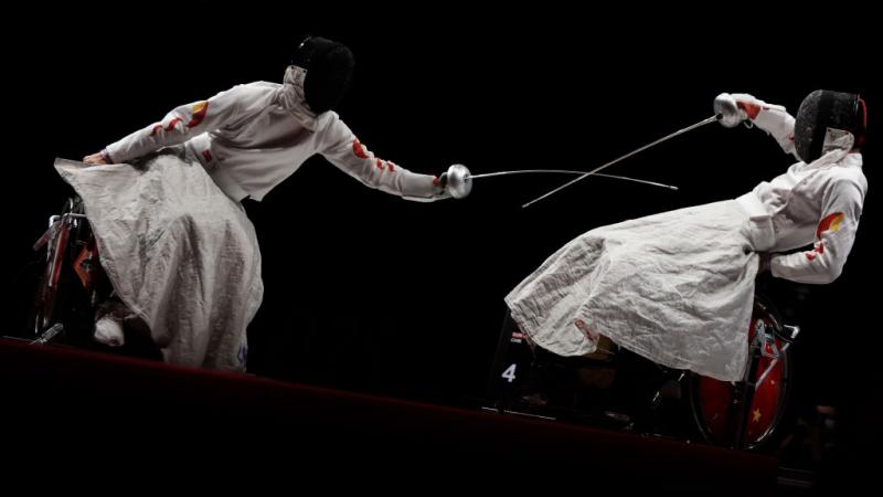 Two wheelchair fencers in action at the Tokyo 2020 Paralympic Games