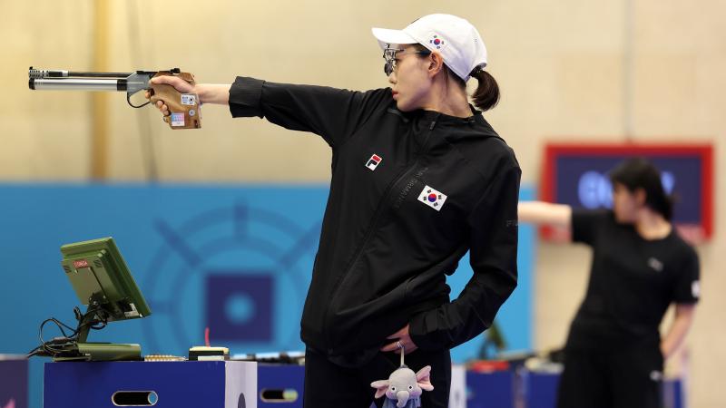 A female shooter in a pistol event
