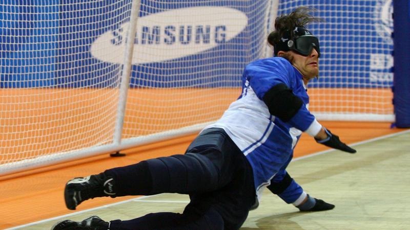 A picture of a blind men playing Goalball