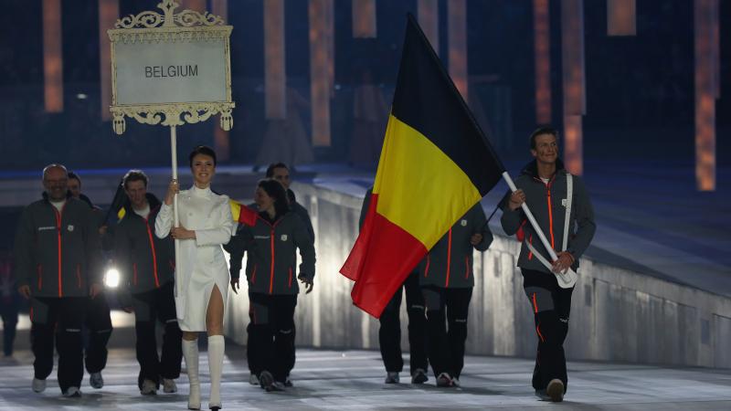 Belgium enter the arena lead by flag bearer Denis Colle during the Opening Ceremony of the Sochi 2014 Paralympic Winter Games