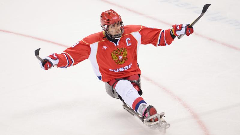 Dmitrii Lisov of Russia celebrates after scoring a penalty during the Ice Sledge Hockey match between the Russia and Korea