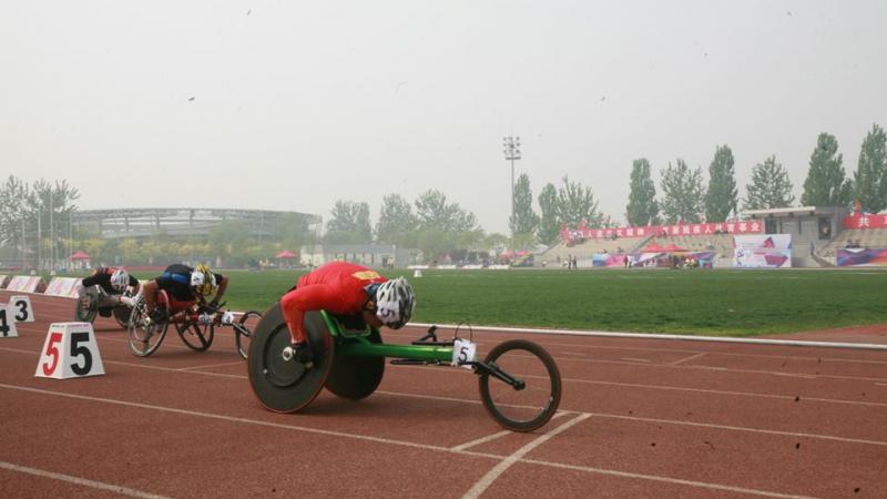Athletes compete in a wheelchair race at the 2014 IPC Athletics Grand Prix in Beijing