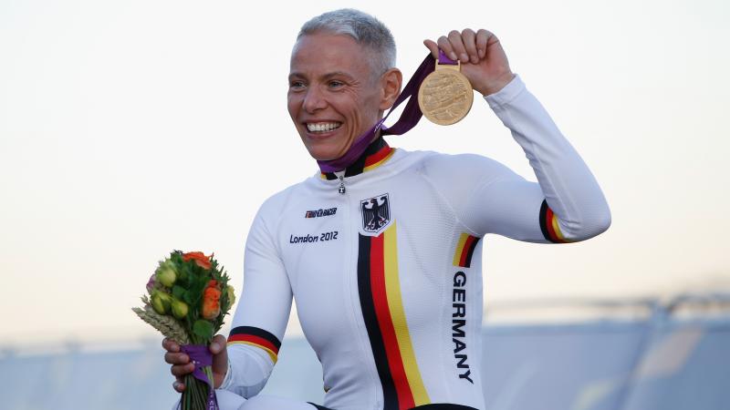 Germany's Andrea Eskau recevies her gold medal after winning the women's H4 road race at the London 2012 Paralympic Games at Brands Hatch.