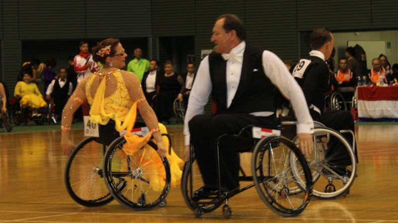 Two dancers in wheelchairs posing during a performance