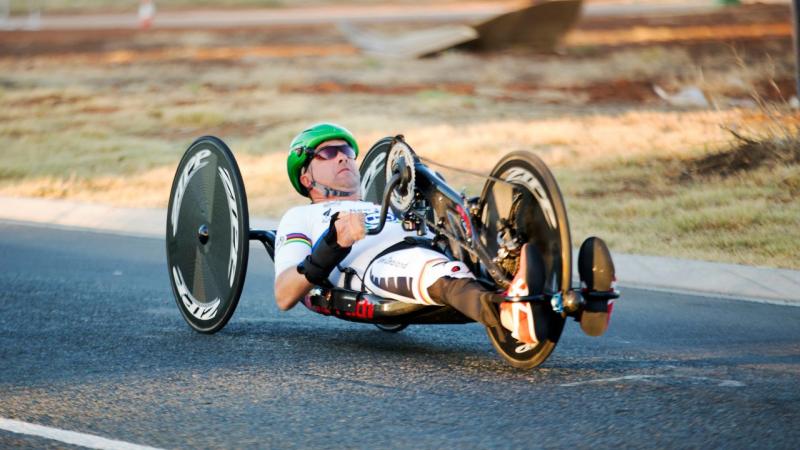 Man in a handbike on a road