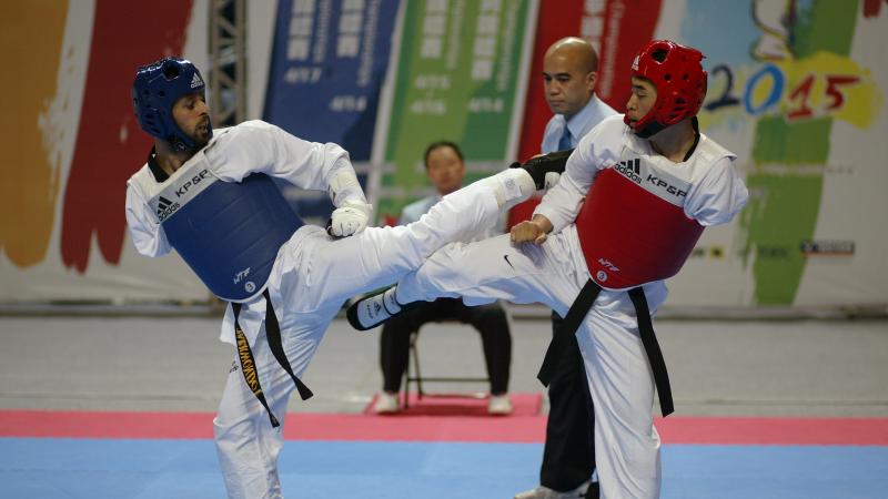 Two athletes performing in taekwondo