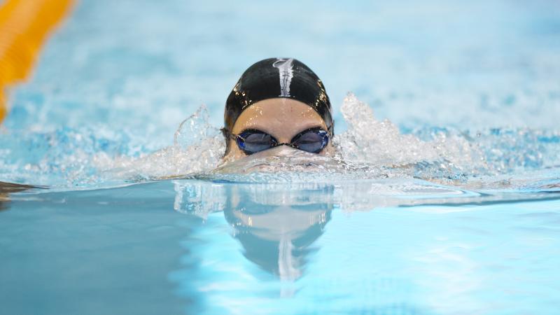 A swimmer's head rising out of the water