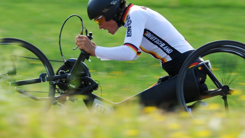 Women on handbike cycling 