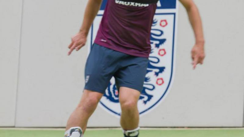 Player kicks ball.