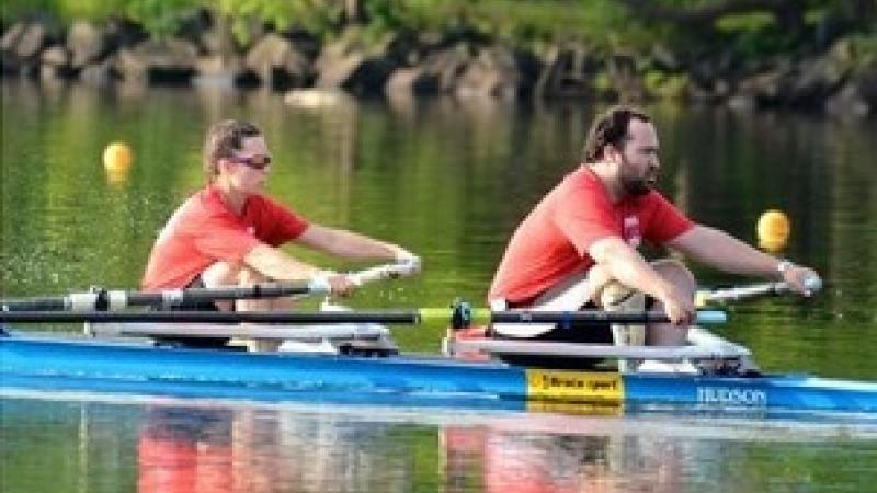 Man and woman in a boat, rowing