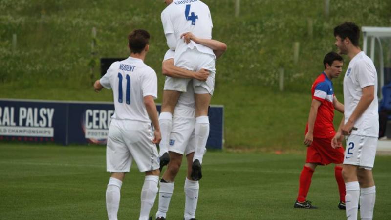 A football 7-a-side player celebrates scoring a goal