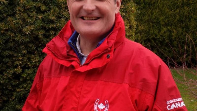 Portrait photo of a man in a red jacket