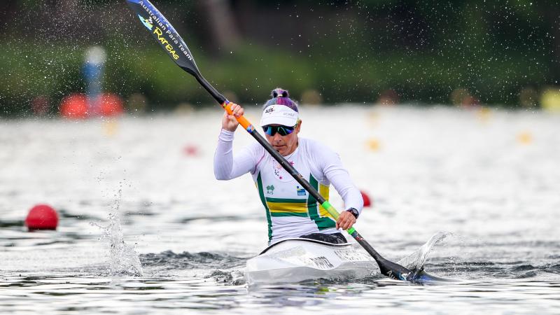 Woman paddles in kayak