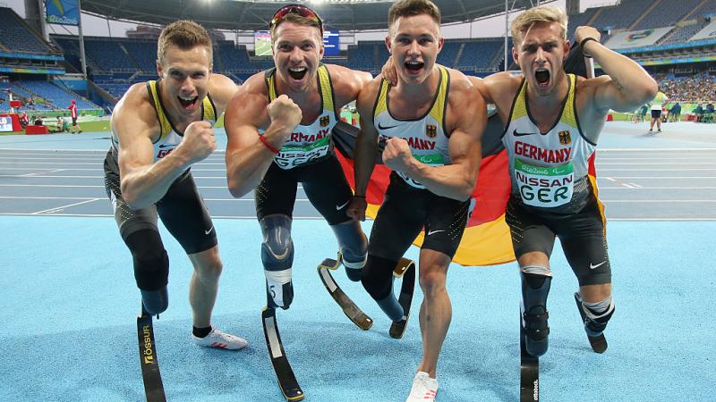 Markus Rehm, David Behre, Felix Streng and Johannes Floors of Germany celebrate after winning the gold medal in the Men's 4x100m - T42-47 final at the Rio 2016 Paralympic Games.