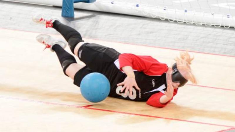 Blindfolded women stopping a ball