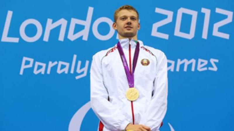 A picture of a man with a gold medal around his neck