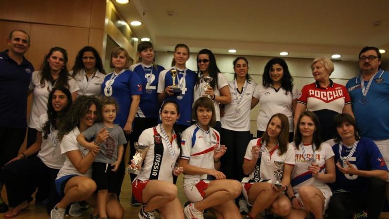 a group of goalball athletes smile for the camera